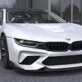 White BMW Sports Car With Sleek Front Grille And Headlights