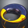 Blue And Gold Textured Metallic Bracelet With Circular Design Shiny Surface