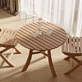 Wooden Round Table With Two Folding Chairs Water Bottle And Glasses On Carpet White Curtains