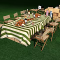 Outdoor Chairs Around Long Green And White Striped Table With Food Drinks Utensils On Grass