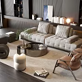 Modern Gray Sofa And Round Coffee Table Set With Brown Chairs Rug Bookshelves And Decor