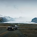 Vintage Car Driving Through Snowy Mountains And Glacier In Open Landscape