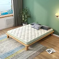 Comfortable Quilted Mattress On Wooden Frame With Grey Pillows Green Wall And Indoor Plant