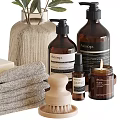 Stylish Bathroom Accessories With Towels Soaps Vase And Amber Bottles