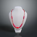 Fashionable Red Beaded Necklace on White Mannequin with Chain Details