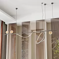 Modern Curved Metallic Chandelier With Warm Circular Lights Hanging In Elegant Interior
