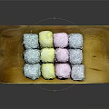 Colorful Glutinous Rice Cakes Arranged On Wooden Tray With Coconut Coating