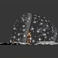 Cute Spotted Fawn Standing Inside Glass Globe On Snowy Ground With Falling Snowflakes