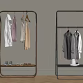 Modern Metal Clothes Rack With Hanging Shirts Dresses And Shoes On Lower Shelf