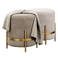 Two Round Gray And Light Gray Ottoman Stools With Gold Metal Frame And Decorative Bands