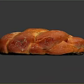 Freshly Baked Braided Bread With Golden Brown Crust And Powdered Sugar Topping