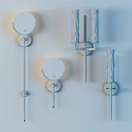 Modern Wall Sconces With Marble Texture Shades And Golden Metal Brackets On Wooden Wall