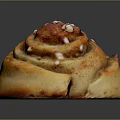 Swirled Cinnamon Roll With Golden Brown Surface And White Sugar Sprinkles