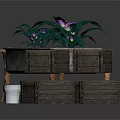 Purple Flowering Plants In Metal Planter On Wooden Stand With Wooden Crates And Metal Bucket