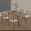 Minimalist Wooden Dining Table Set with Rattan Back Padded Seats Vase Plant and Fruit Bowl