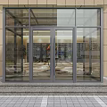 Transparent Glass Swing Door With Black Frame At Building Exterior Entrance Steps