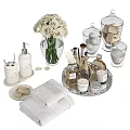 Elegant Bathroom Accessories with White Roses Towels Hand Soap and Glass Jars