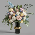 Colorful Mixed Flowers Arrangement In Black Vase With Gold Base And Green Leaves Ferns