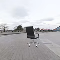 Modern Black Office Chair With Silver Metal Armrests And Swivel Caster Wheels