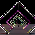 Event Passage With Colorful Neon Diamond Shaped Frames And Person Standing