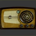 Vintage Electronic Radio With Wooden Frame Orange Exterior And Control Knobs