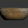 Traditional Handcrafted Clay Bowl With Intricate Carved Patterns And Textured Surface