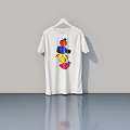 White T Shirt With Colorful Pattern Hanging On Hanger Against Gray Wall