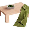 Light Colored Coffee Table With White Bowl Green Items And Green Throw 3d model