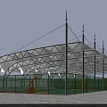 Tensile Membrane Structure Covering Basketball Court With Supporting Poles And Green Fencing