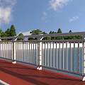 Safety Road Facilities With White Guardrail Red Walkway And Green Trees