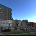 Modern Urban Commercial Street With Glass Facades Shopping Mall Pedestrians And Vehicles