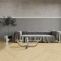 Modern Multi person Sofa Covered with Gray Blanket and Glass Coffee Table Near Green Plant