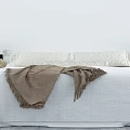 Minimalist Double Bed Interior With White Bedspread Brown Throw Blanket Pillows And Nightstand Lamp