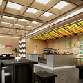 Modern Bubble Tea Shop Interior Design With Wooden Ceiling Counter And Seating Area