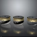 Three Decorative Storage Containers With Gold Lids White Silver Bodies And Intricate Patterns 3d model