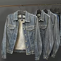 Classic Blue Denim Jackets and Jeans Hanging on Metal Rack for Casual Fashion