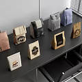 Various Coffee Bags In Different Colors And Designs On Office Table