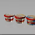 Danone Yogurt Cups With Red Lids White Bodies Different Flavors And Reflections On Dark Background