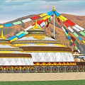 Colorful Prayer Flags Over Ornate Traditional Yurts Against Autumn Mountain Landscape
