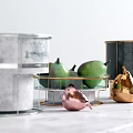 Elegant Ceramic Vessels with Marble Texture and Gold Accents on Kitchen Counter with Fresh Fruits