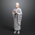 Bald Headed Man in Traditional Gray Robe with Hands Clasped in Prayer Position
