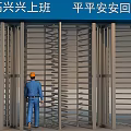 Worker Wearing Orange Safety Helmet Passing Through Turnstile Gate With Safety Slogan