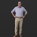 A Man In Purple Shirt And Khaki Pants With Hands On Hips Against Dark Background