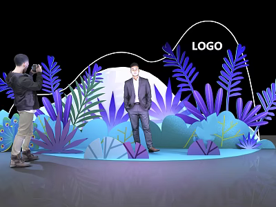 Man in Suit on Stage with Purple Blue Plants LOGO and Photographer Taking 3d model