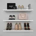 Various Stylish Shoes Placed on White Shelves with Chanel Bag Pink Purse and Boxes