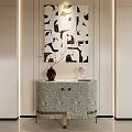 Modern Entryway Cabinet Console Table With Patterned Design Vase Sculpture And Wall Art