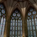 Religious Faith Reflected In Gothic Church Stained Glass Windows And Arches