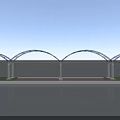Blue Arch Bridge with Steel Structure and Vehicles Over Water Surface Supported by Piers