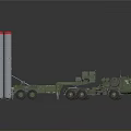 Military Vehicle Transporting Large Cylindrical Launchers With Red Top Sections