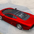 Sleek Red Sports Car With Black Roof Alloy Wheels On Dirt Ground